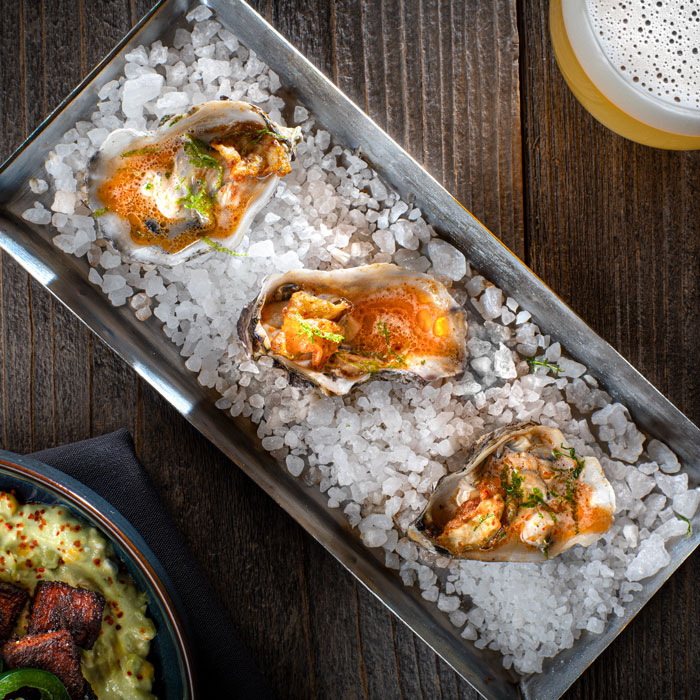 carson kitchen grilled oysters michelada butter credit chris wessling